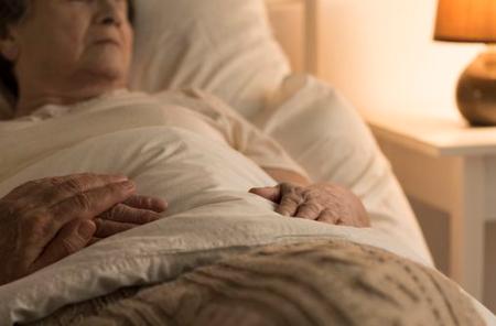 Close-up of person supporting sick family member at home